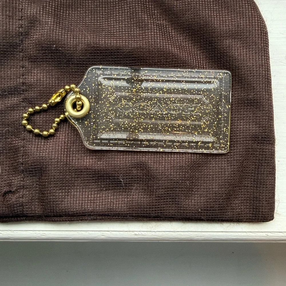 Coach Poopy Clear and gold‎ Glitter Hang Tag